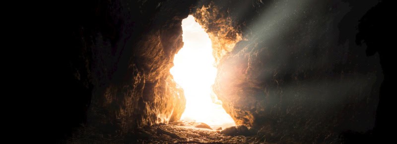 Sunlight streams through the cave entrance, illuminating the rocky interior like hope at Baton Rouge Presbyterian Church services.