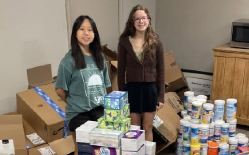 Two girls sort supplies in a room at First Presbyterian Church, making volunteer help quick and easy.